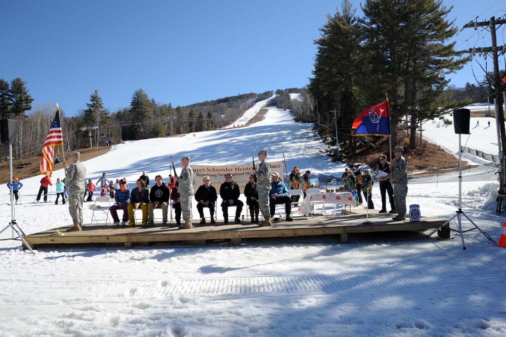 The color guard posts the National and 10th Mountain Division colors.